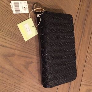 Black zip around wallet. Never used.